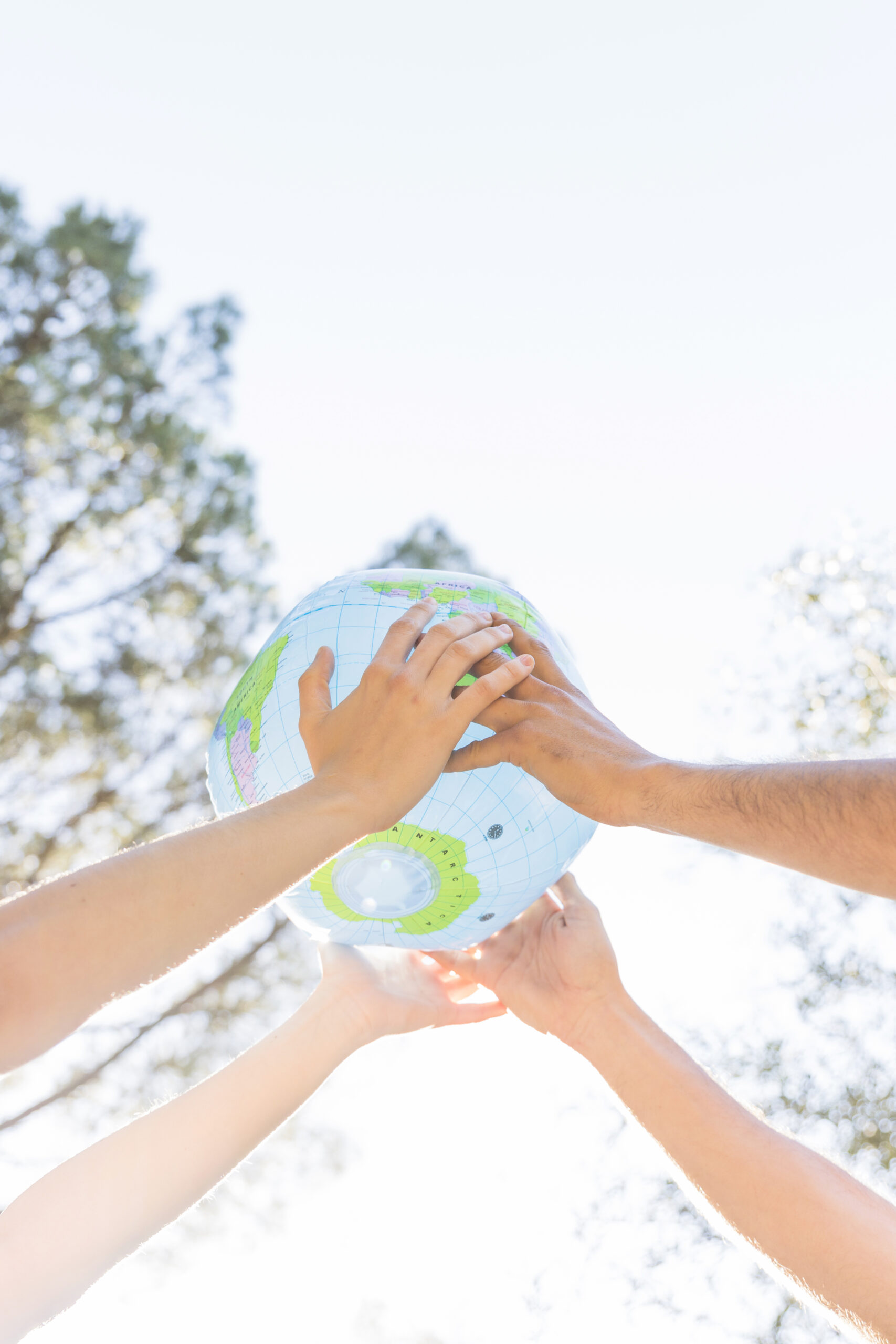 hands holding planet model nature